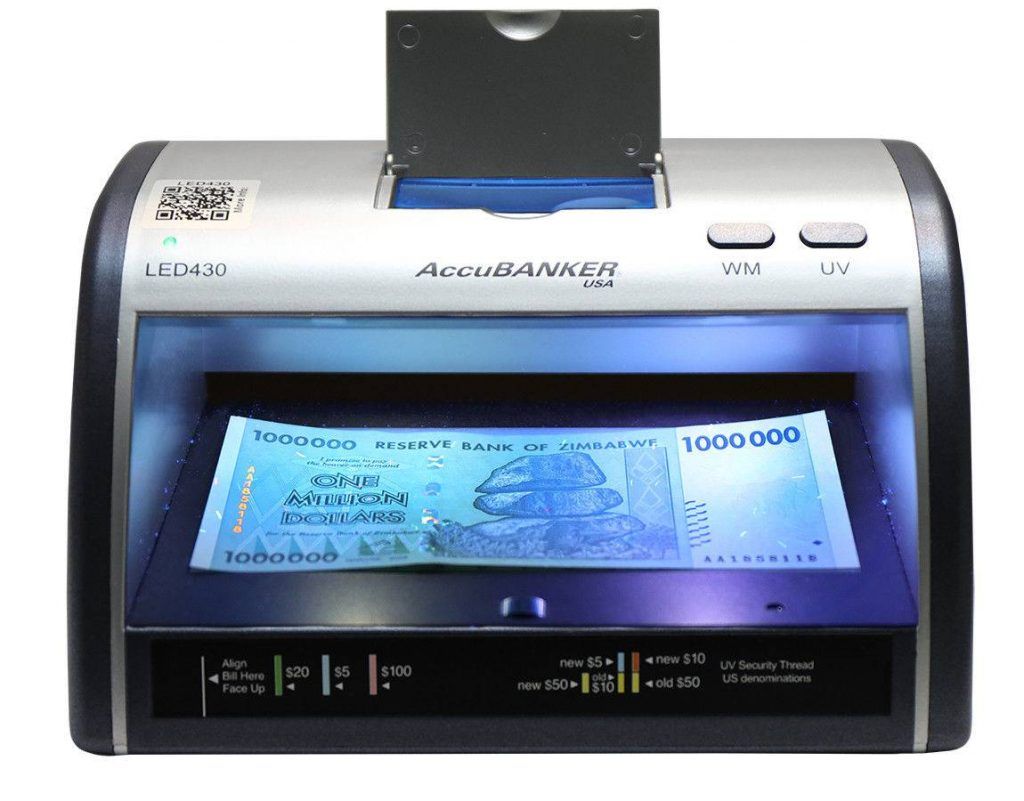 UV light used to detect security features on a banknote